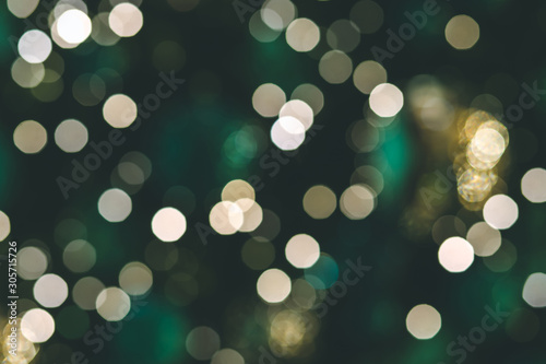 Background of Christmas light bokehs decorating on pine tree