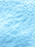 Snowflakes on snow background.