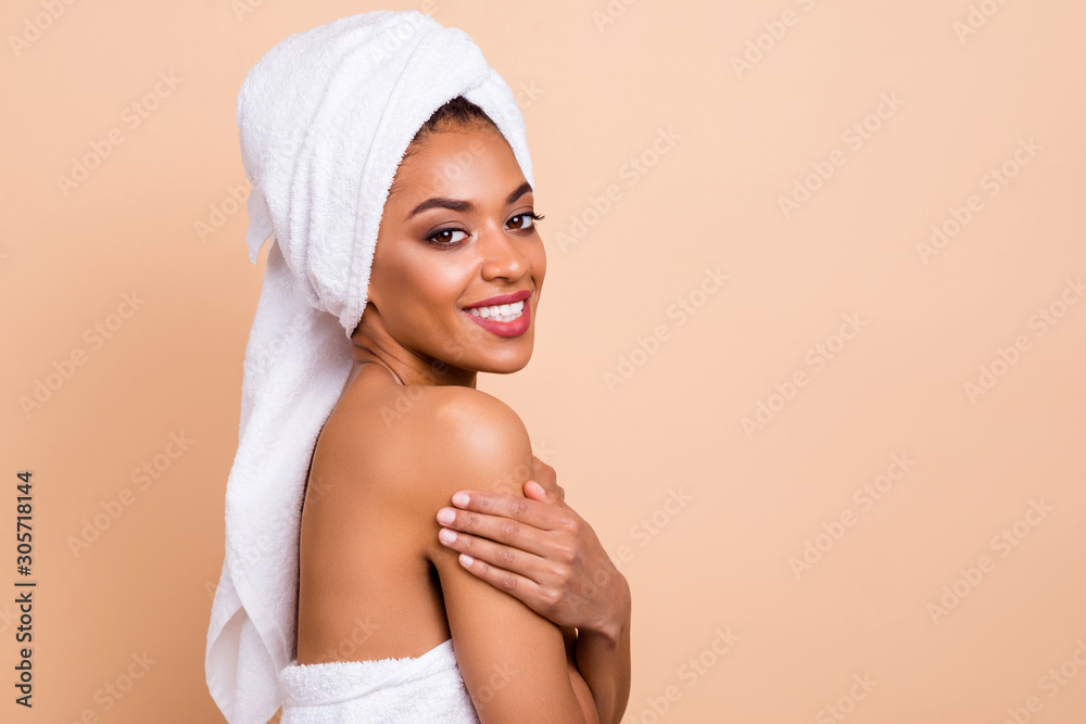 Close-up profile side view portrait of nice-looking attractive gorgeous well-groomed cheerful lady after taking useful bath caressing sensitive gentle skin isolated on beige pastel background - obrazy, fototapety, plakaty 