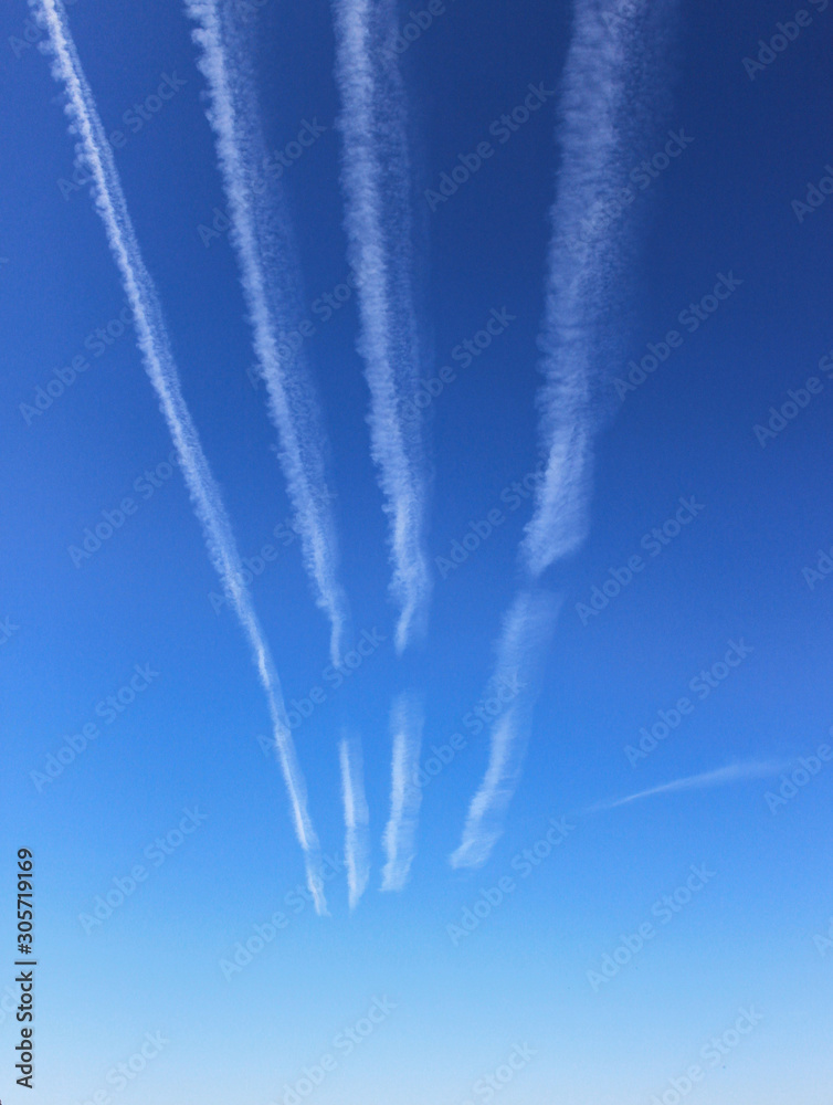 plane tracks in the blue sky plane tracks in the blue sky