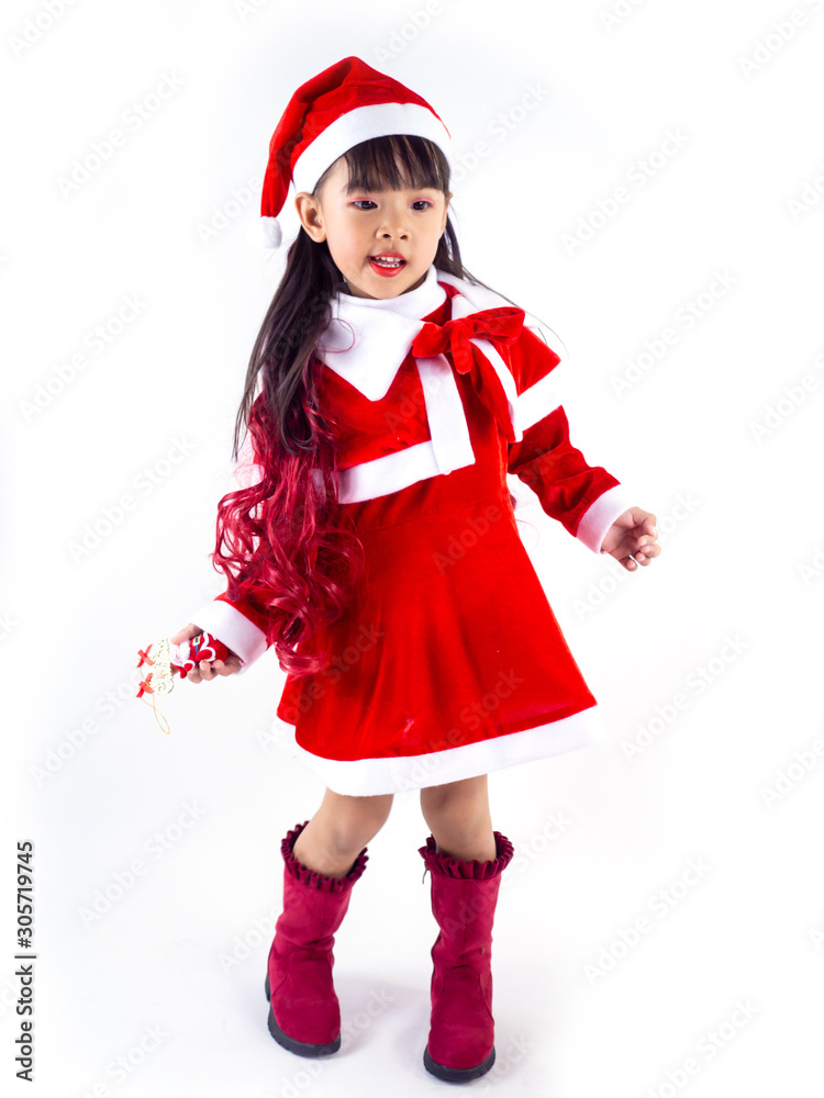 Asian girl is wearing a Santa costume to celebrate Christmas. White background Asian girl is wearing a Santa costume to celebrate Christmas. White background