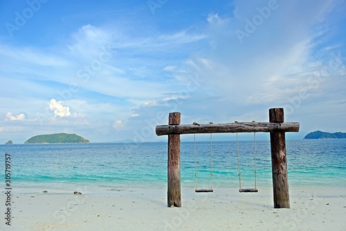 Twin swings on the beach as landmark of Madame beach in Nyaung Oo Phee Island, Myanmar.