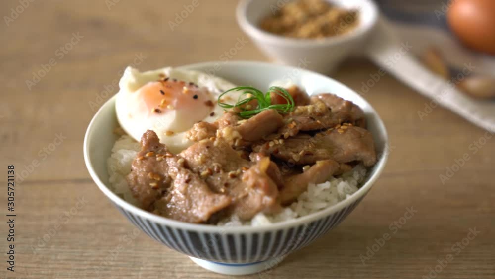 stir-fried pork with garlic on topped rice with egg - asian food style stir-fried pork with garlic on topped rice with egg - asian food style