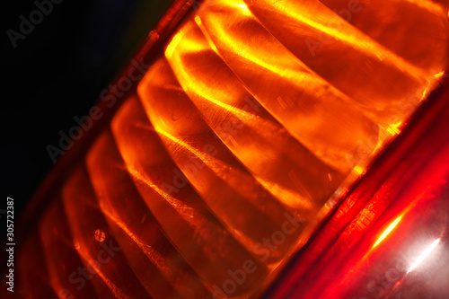 Taillight of the car in sunlight. Abstract background photo