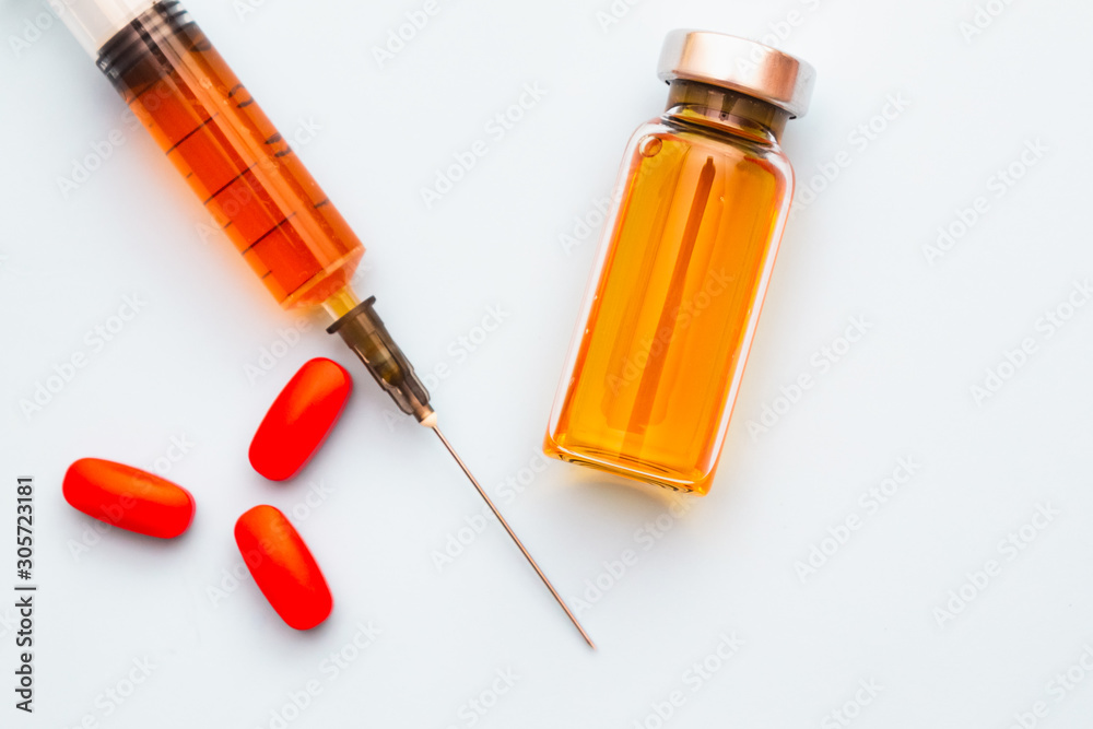 syringe with vial on blue background. Medicine. syringe with vial on blue background. Medicine.