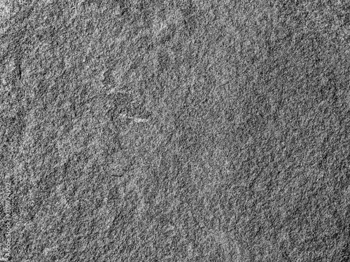 grain stone texture, black-and-white background, concrete close up ; gray sand macro