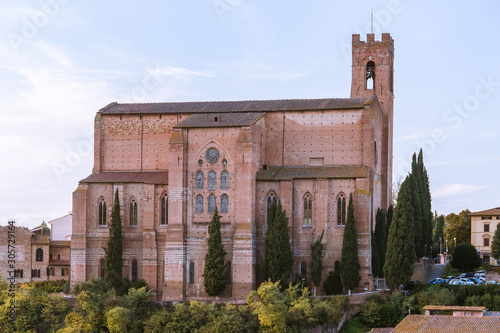 Building of the Basilica di San Domenico in Siena, Tuscany. Along the left side of the church is a bell tower, which reduced in height, due to the earthquake of 1798.