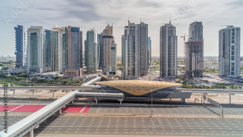 Aerial top view to Sheikh Zayed road from Dubai Marina with JLT skyscrapers timelapse during all day, Dubai. © neiezhmakov