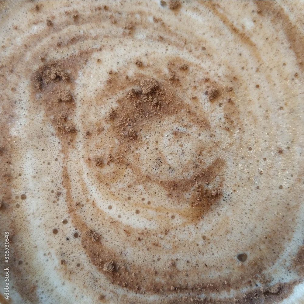 Cappuccino coffee with foam and cinnamon. View from above. Close-up. Cappuccino coffee with foam and cinnamon. View from above. Close-up.