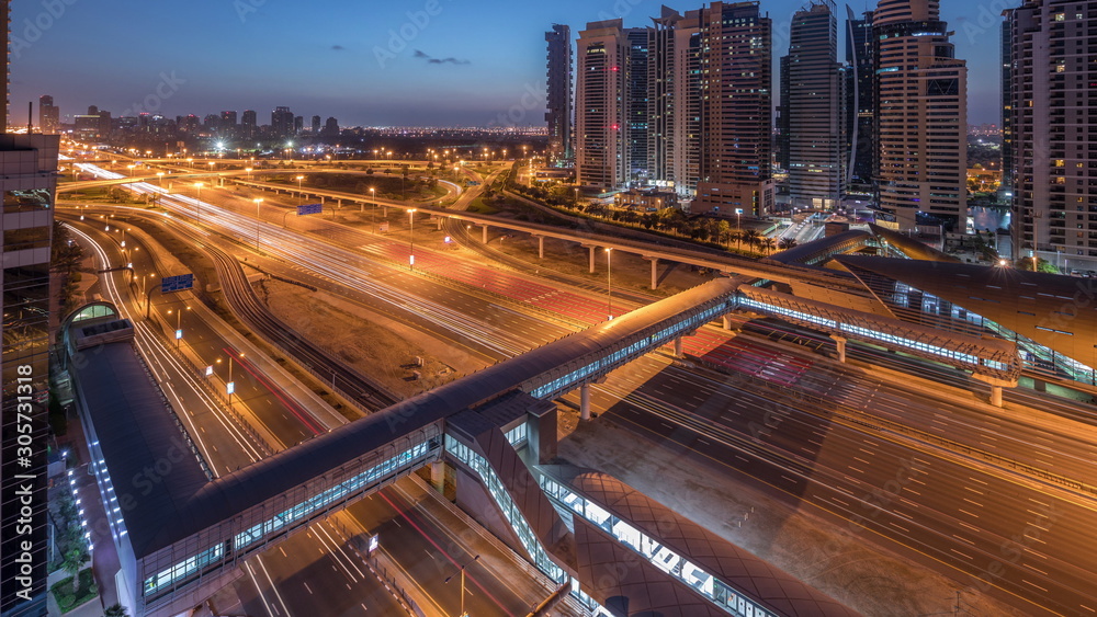 Aerial top view to Sheikh Zayed road near Dubai Marina and JLT night to day timelapse, Dubai. Aerial top view to Sheikh Zayed road near Dubai Marina and JLT night to day timelapse, Dubai.