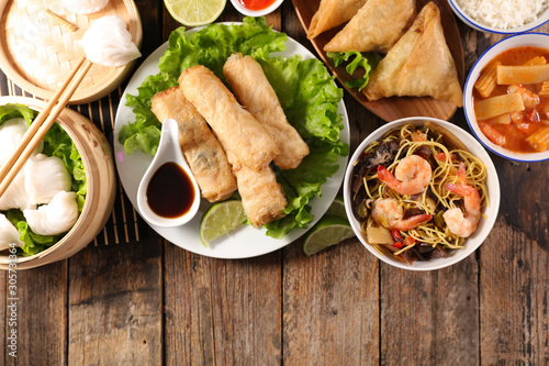 assorted of asian food with spring roll, soup, shrimp, rice