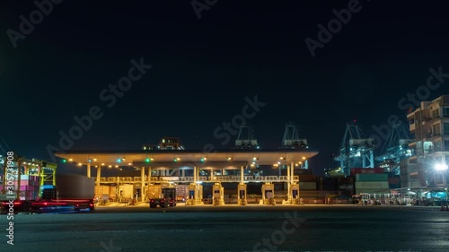 Timelapse trailer trucks with container cargo at port,logistic import export and transport industry.