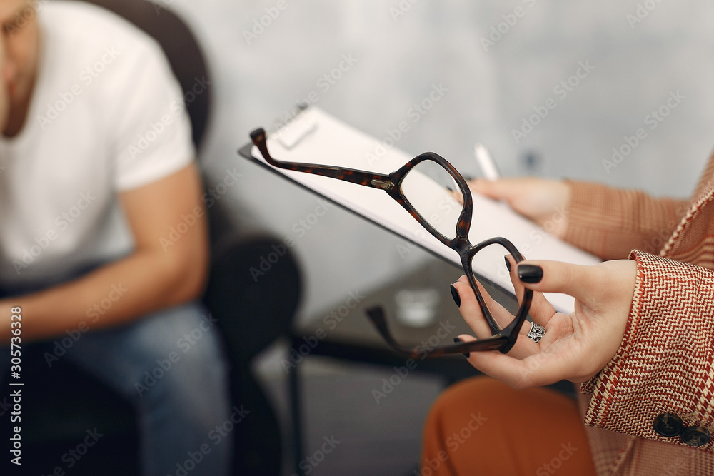 In the psychologist's office. Man and woman talking