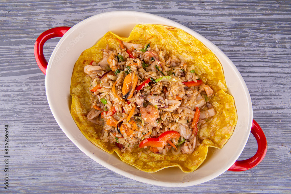 Rice with seafood on wax, served in Kazan