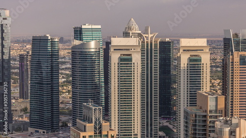 Dubai Marina skyscrapers and jumeirah lake towers view from the top aerial timelapse in the United Arab Emirates.