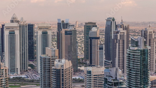 Dubai Marina skyscrapers and jumeirah lake towers view from the top aerial timelapse in the United Arab Emirates. © neiezhmakov