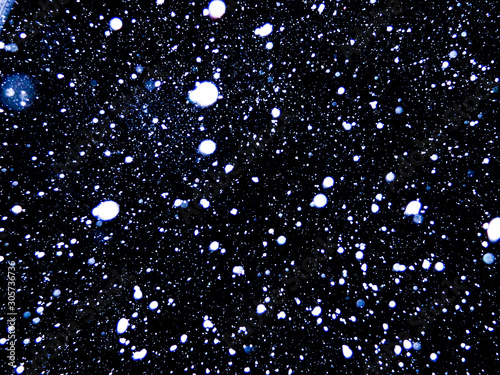 falling snowflakes on black background
