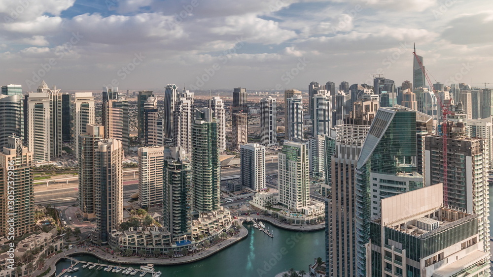 Dubai Marina skyscrapers and jumeirah lake towers view from the top aerial timelapse in the United Arab Emirates.