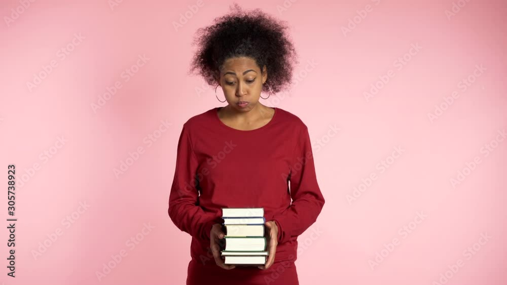 African american student is dissatisfied with amount of homework and books. Girl is annoyed, discouraged frustrated by studies. 4k African american student is dissatisfied with amount of homework and books. Girl is annoyed, discouraged frustrated by studies. 4k