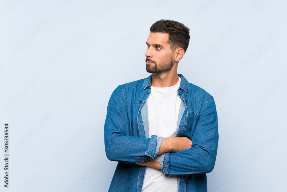 Handsome man over isolated blue background portrait Handsome man over isolated blue background portrait
