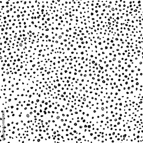 Hand drawn monochrome polka dot seamless pattern on white background.
