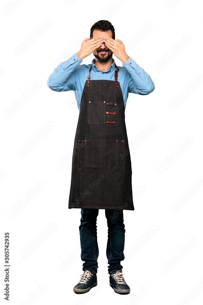 Full-length shot of Man with apron covering eyes by hands over isolated white background Full-length shot of Man with apron covering eyes by hands over isolated white background