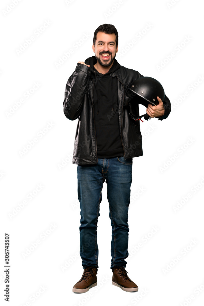 Full-length shot of Biker man celebrating a victory in winner position over isolated white background Full-length shot of Biker man celebrating a victory in winner position over isolated white background