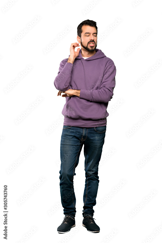 Fototapeta premium Full-length shot of Handsome man with sweatshirt having doubts over isolated white background