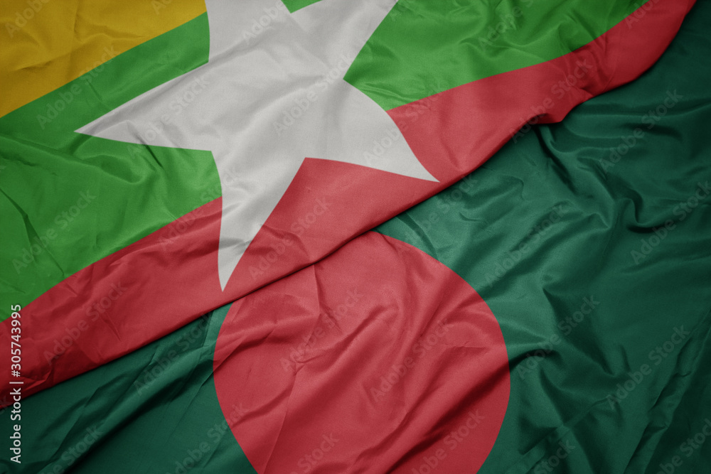 waving colorful flag of bangladesh and national flag of myanmar.
