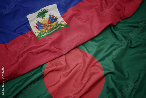 waving colorful flag of bangladesh and national flag of haiti.