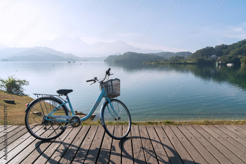 Bicycle on wooden bridge with the nice view in the morning