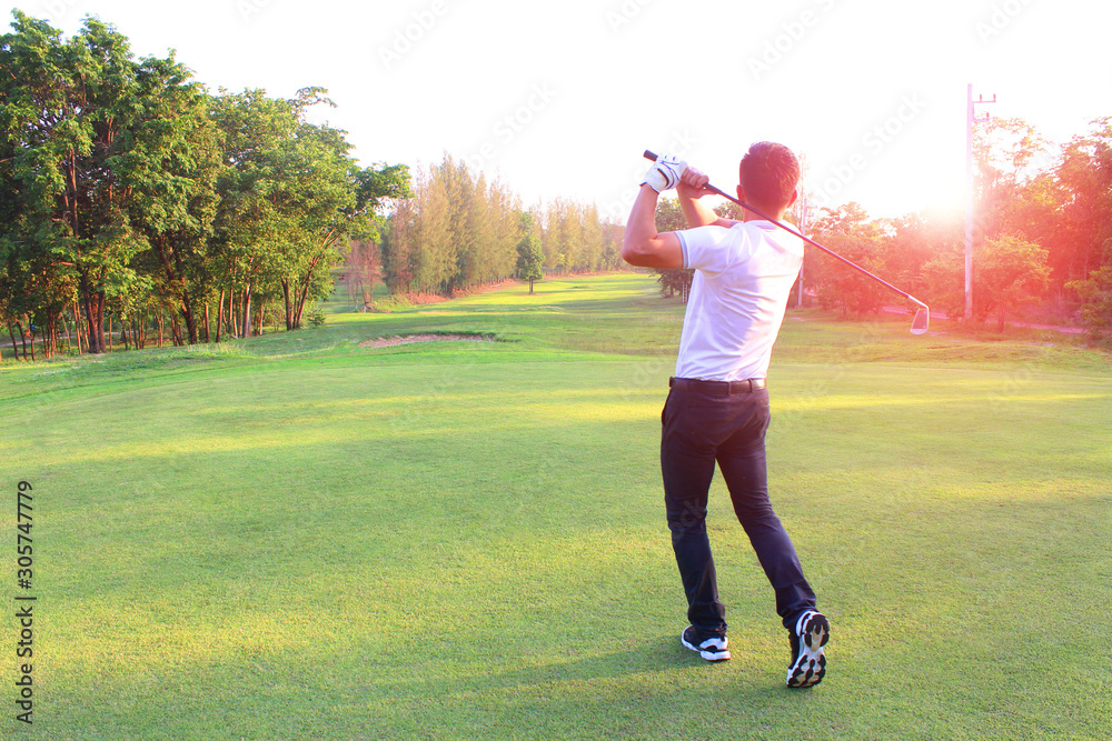 The male golf player on the competition field Start playing golf ball On the green lawn background The male golf player on the competition field Start playing golf ball On the green lawn background