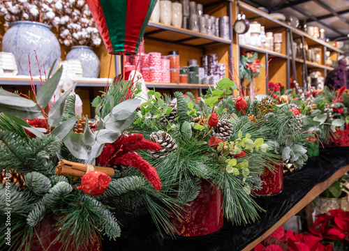 Winter seasonal decor - variety of beautiful floral arrangements specially created for stylish interior design in Christmas - New Year holidays at greek flowers-garden shop for sale.