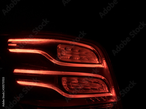 Red LED backlight of modern car at night © Peter Maszlen