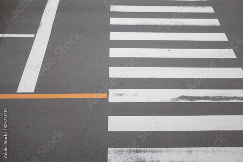 Crosswalk on the road in Japan, for safety people , when people walking cross the street.