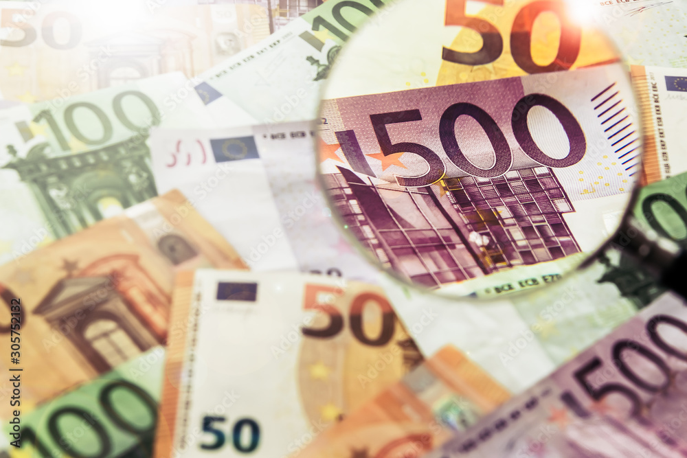 Magnifying Glass with Euro Banknotes Magnifying Glass with Euro Banknotes