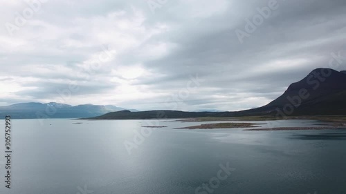 Panning Aerial View Of A Scenic Landscape Beyond The Arctic Circle. Location: Akka Massif, Stuor Muorkke National Park, Northern Sweden, Scandinavia. July of 2018.  photo