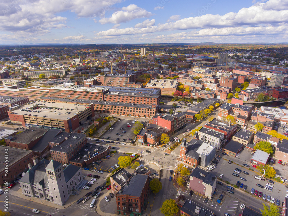 Lowell historic downtown, Canal, Marrimack River and historic Mills aerial view in fall in Lowell, Massachusetts, MA, USA.