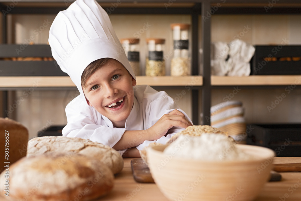 Delighted little baker in kitchen Delighted little baker in kitchen