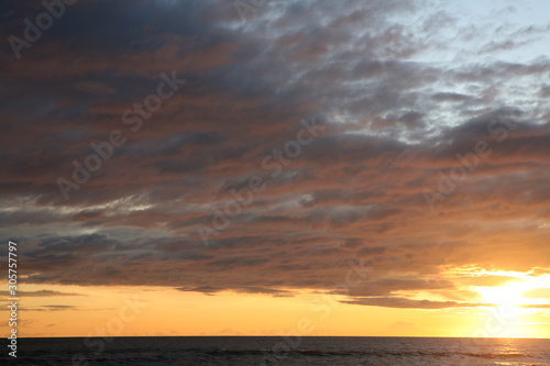Cloudy sunset at the beach  © Marco Colazingari