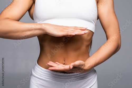 Wallpaper Mural A detail of young sport woman with perfect fitness body isolated on white background Torontodigital.ca