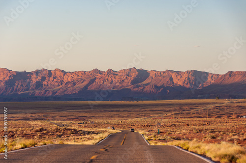 Road leading to the mountains at sunset  USA highway