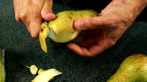 Chef peeling pears