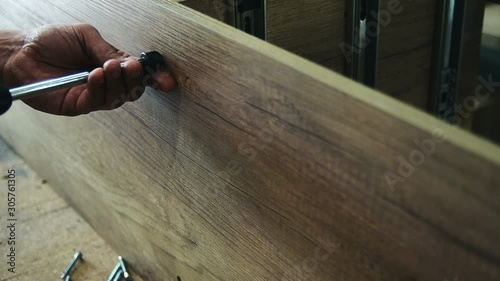 Furniture fittings, wooden dowels for joining furniture elements from chipboard, close-up