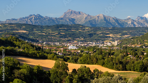 The city of Gap in Summer and the Chaillol Peak in the background. Hautes-Alpes, Alps, Provence-Alpes-Cote d'Azur, France photo