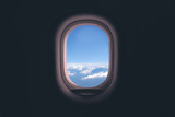 Airplane window. Mountain and clouds view
