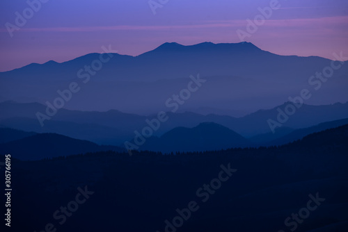Colorful sunset over the mountain hills