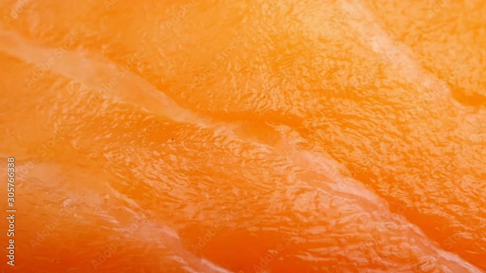 Fresh salmon texture sushi topping. closeup shot. panning left to right. Fresh salmon texture sushi topping. closeup shot. panning left to right.