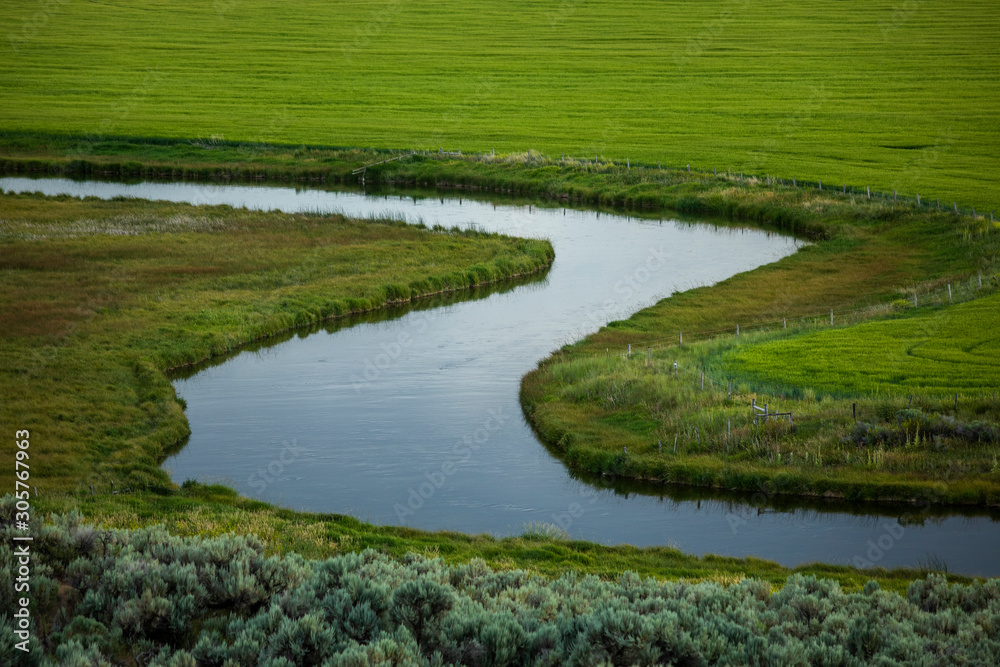 River through fields in Picabo, Idaho, USA River through fields in Picabo, Idaho, USA