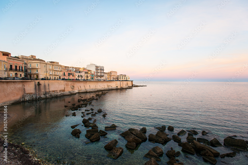 Cityscape of ancient buildings in seafront of Ortygia. Syracuse. Italy